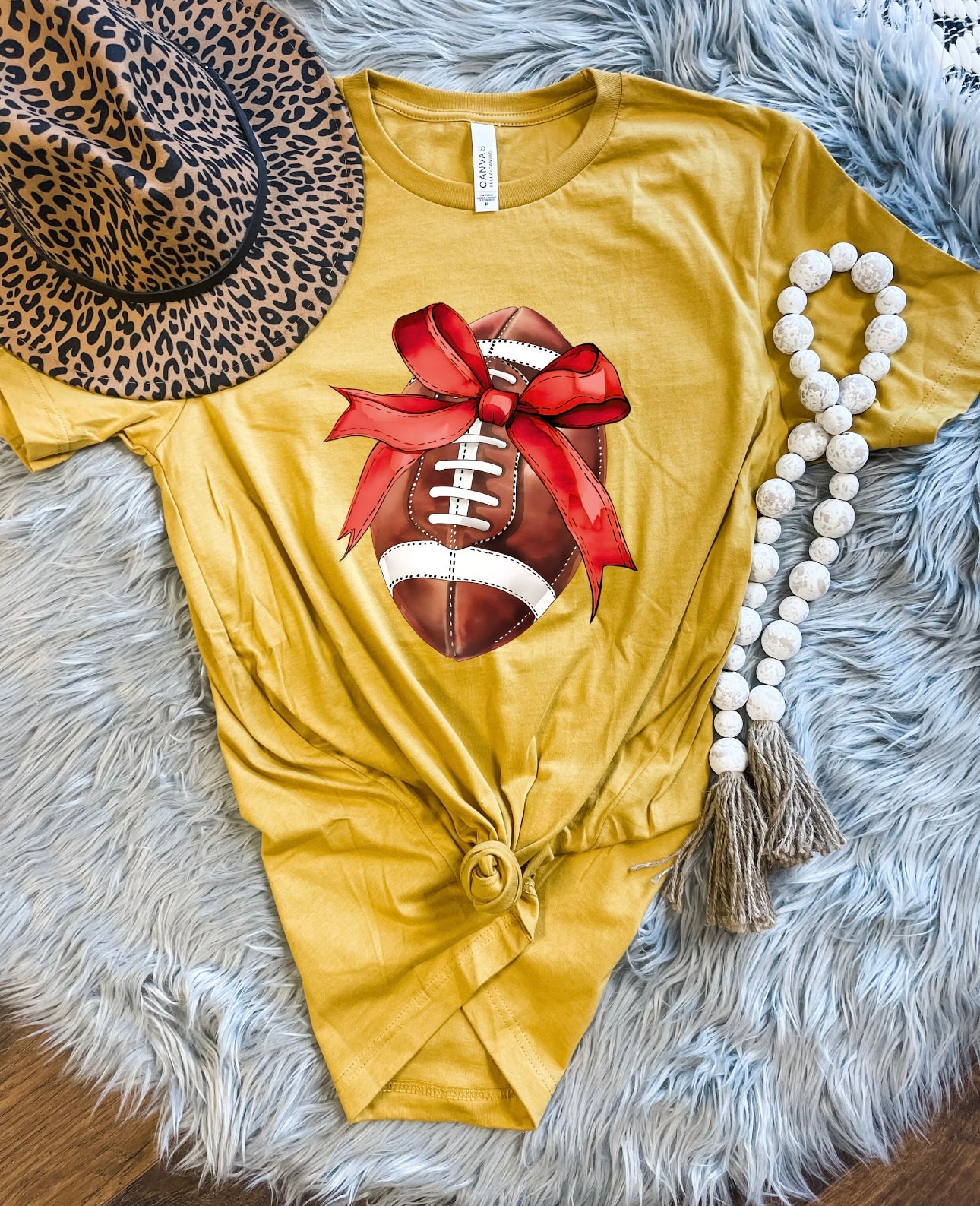 Ribbon Wrapped Football Heather Mustard Tee